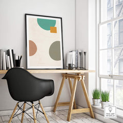 Modern abstract digital print in a stylish workspace, featuring geometric shapes and vibrant colors.