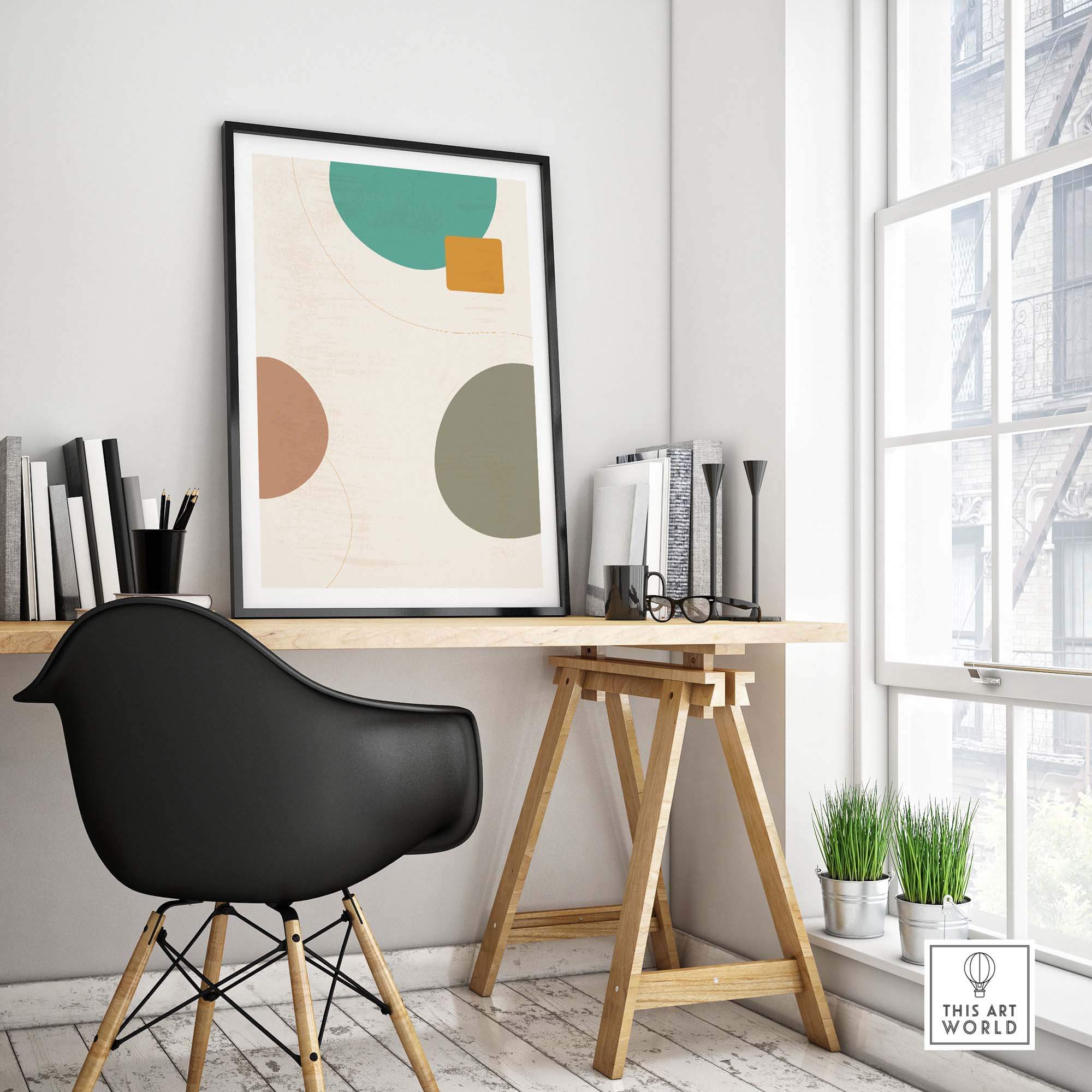 Modern abstract digital print in a stylish workspace, featuring geometric shapes and vibrant colors.