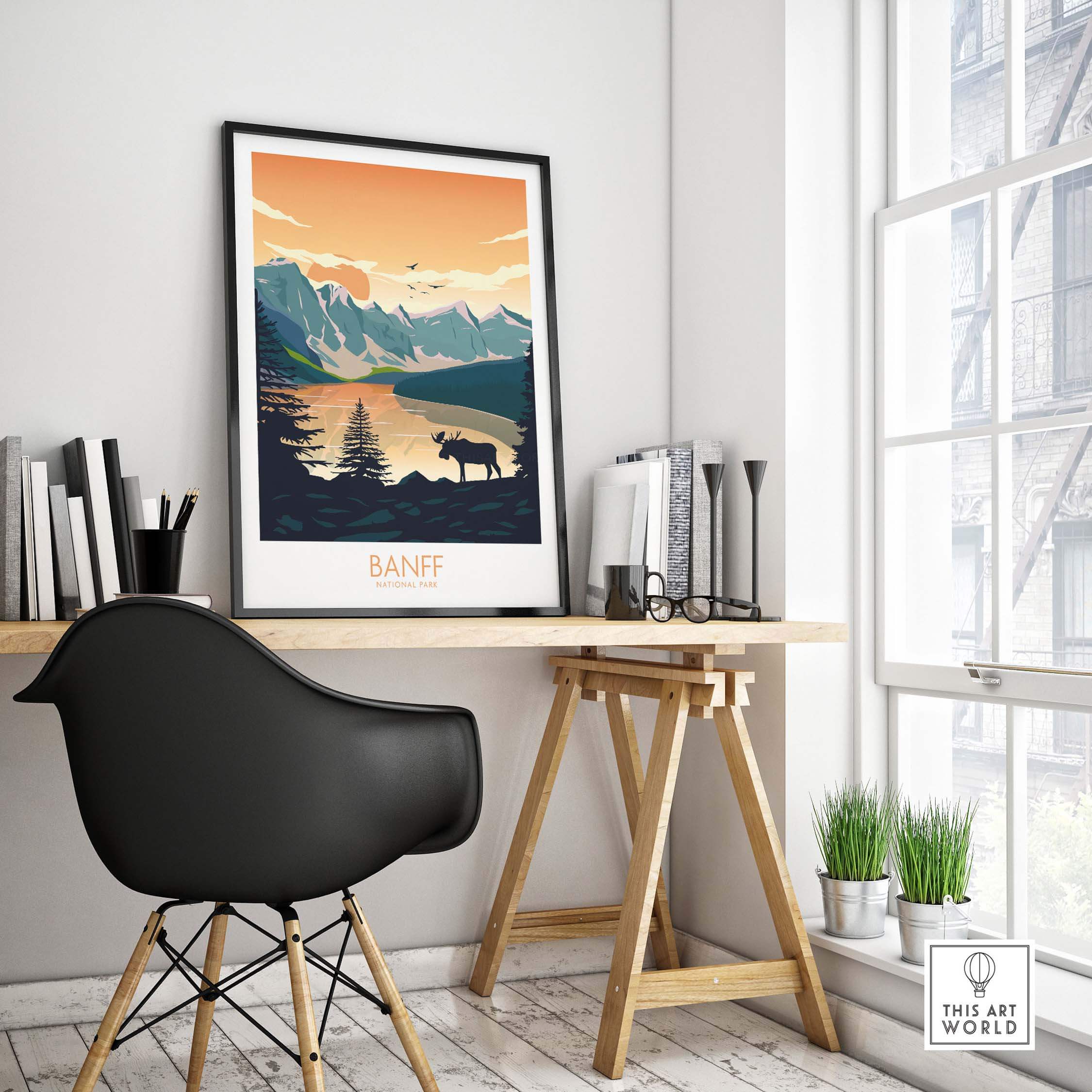 Banff National Park poster hanging in a modern workspace, featuring serene nature and mountain scenery.