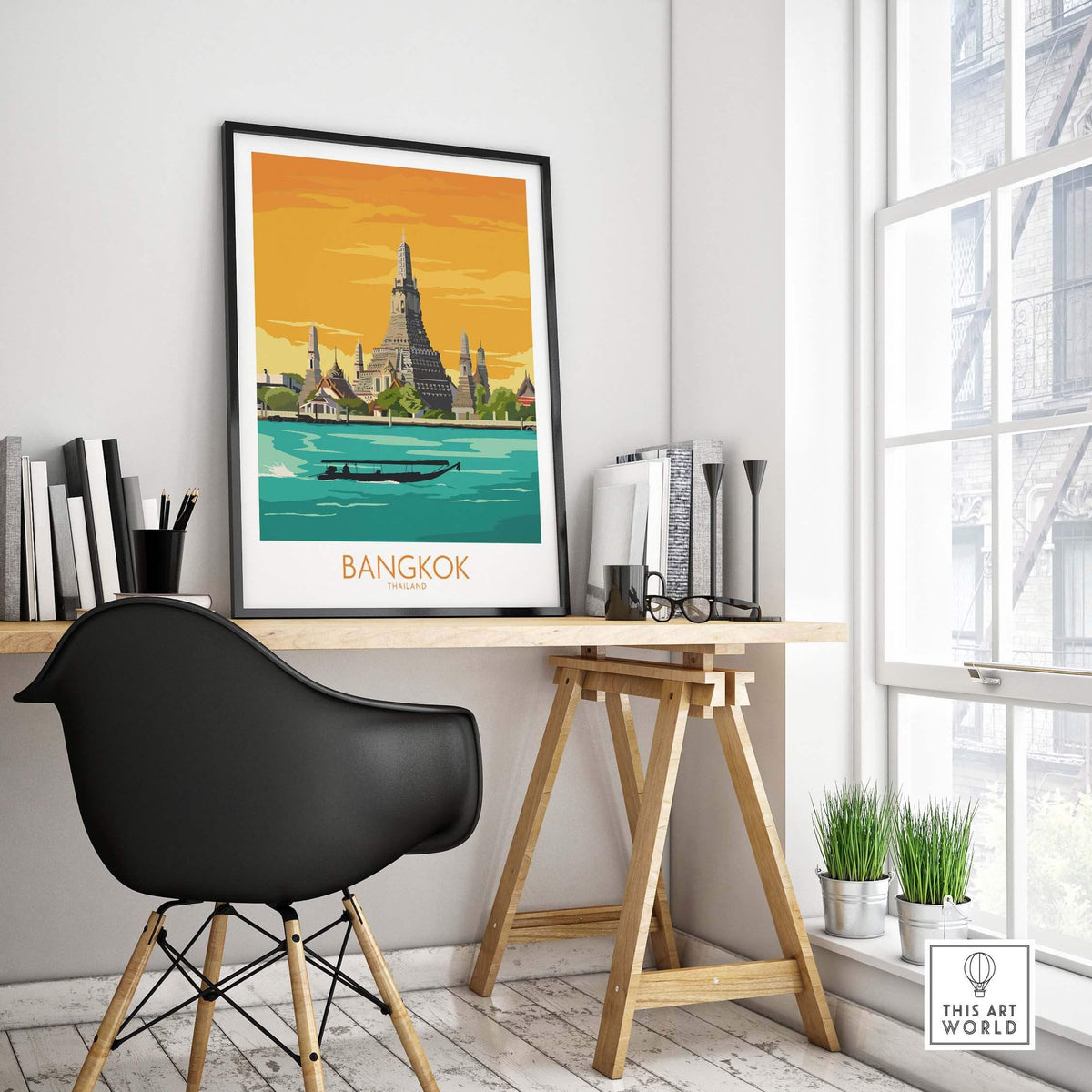 Stylish Bangkok travel poster framed on a desk with modern decor, showcasing Thailand’s iconic landmarks.