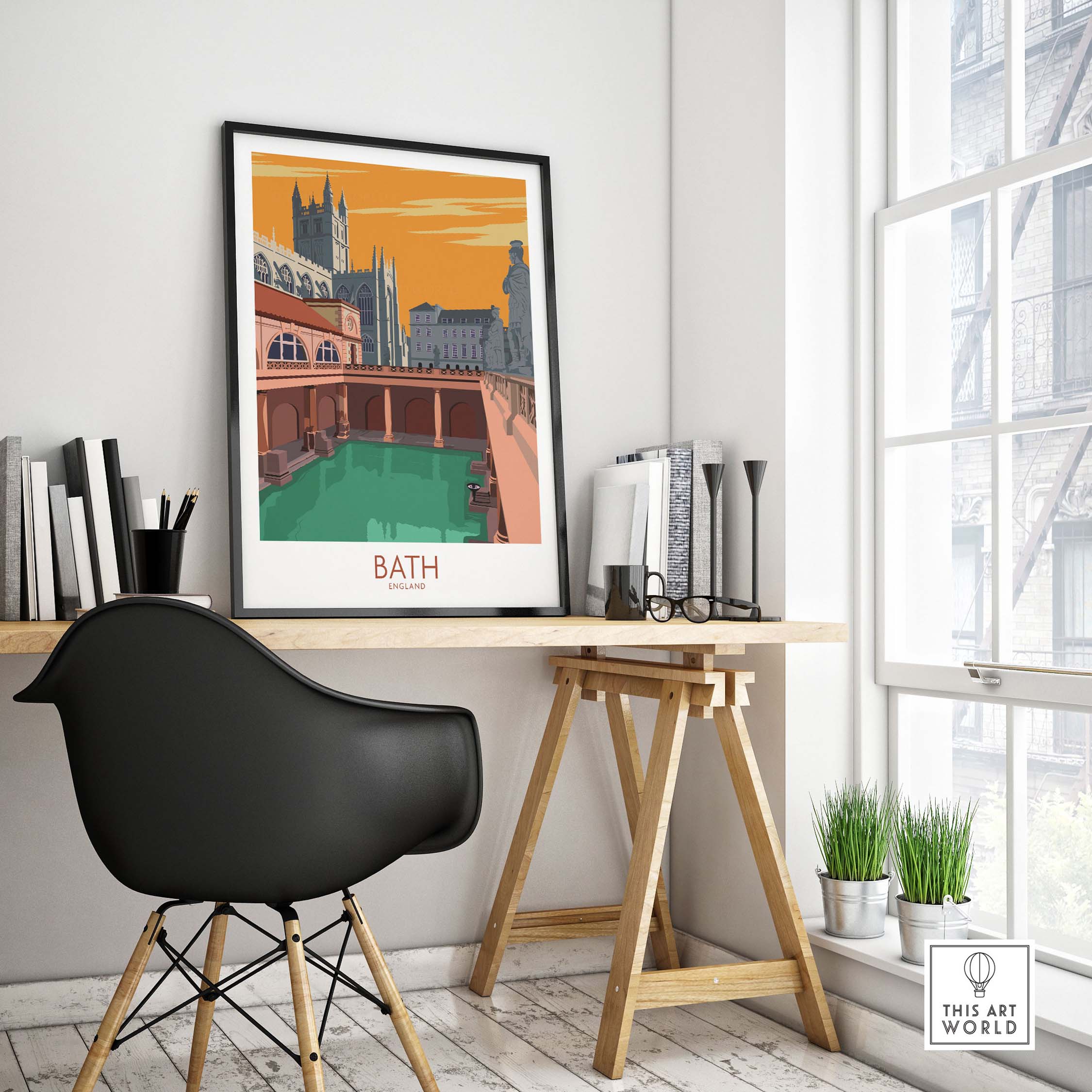 Bath poster print on a desk showcasing vintage travel art of Bath, England with architectural elements and warm colors.