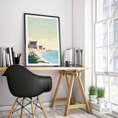 Bonaire travel poster print in a minimalist home office setting, showcasing Caribbean beach inspiration.