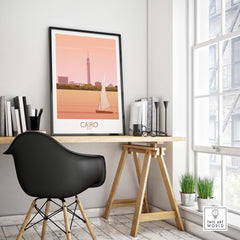 Cairo Travel Poster Print displayed on a desk, highlighting the Nile River and iconic architecture, perfect for home or office decor.