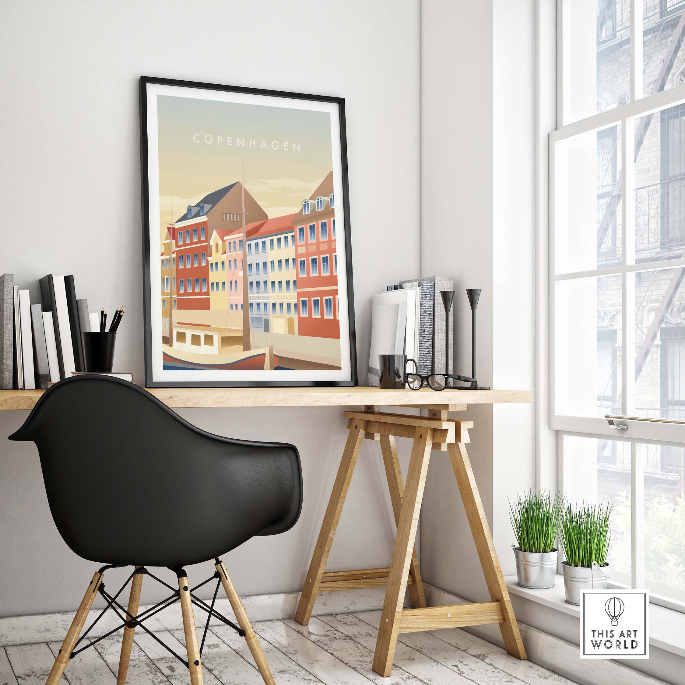 Copenhagen wall art poster displayed in a stylish workspace with a black chair and natural light.