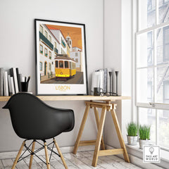 Lisbon poster featuring vintage tram, styled office decor in bright interior, showcasing travel-inspired art.
