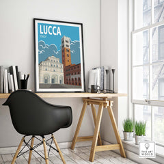 Lucca Italy vintage travel poster wall art print displayed in a stylish home office setting, framed and on a desk.