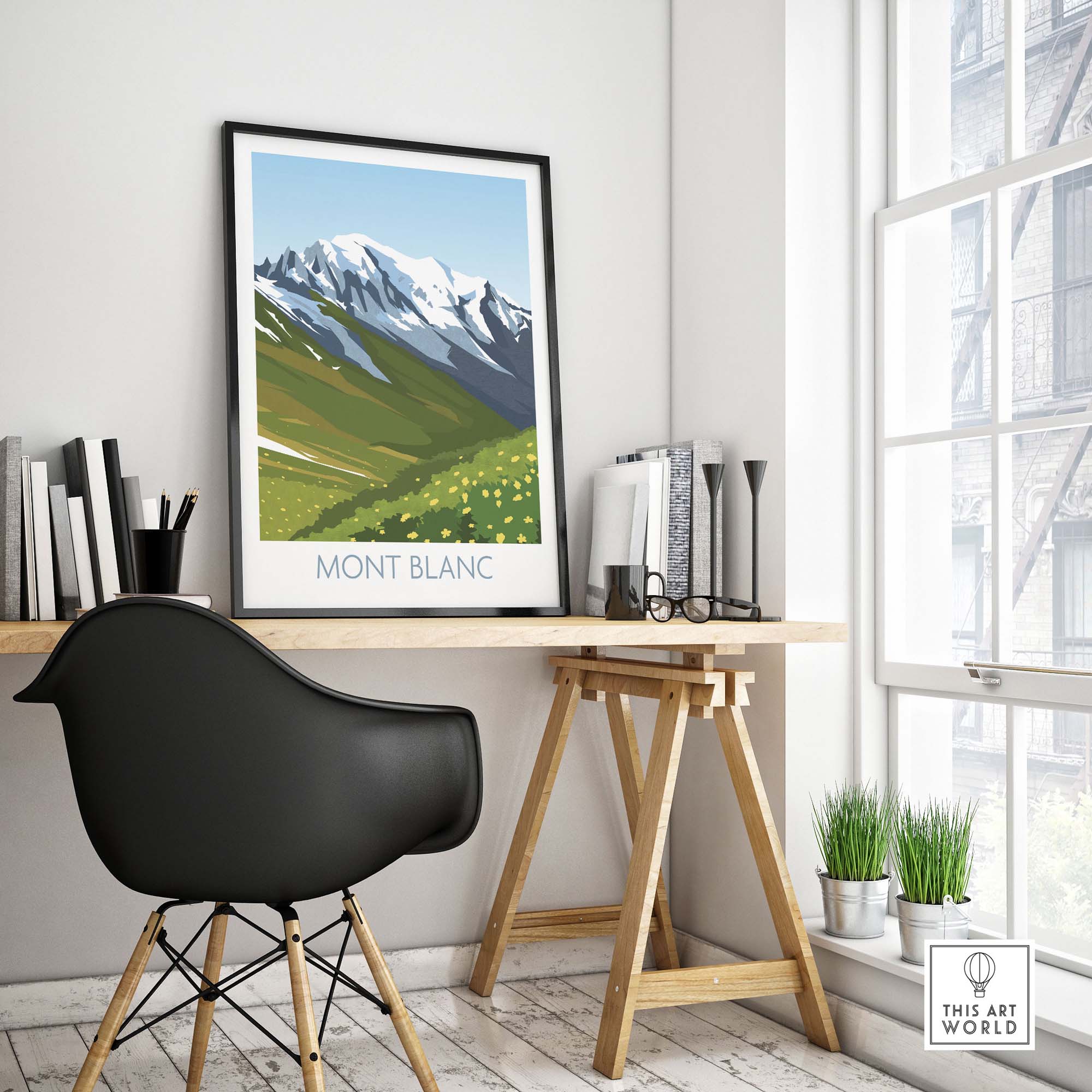 Mont Blanc travel poster in a stylish home office setting, featuring green hills and snowy mountains.