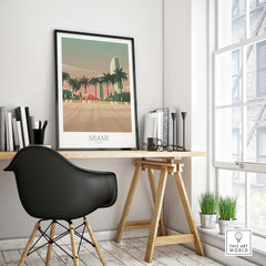 Miami Wall Art Poster Print displayed on a desk, showcasing vintage travel design and palm trees for stylish decor.