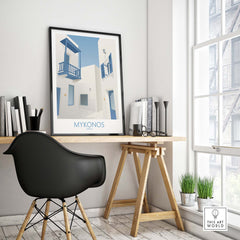 Mykonos wall art print displayed in a stylish office setting, evoking travel wanderlust and vintage aesthetics.