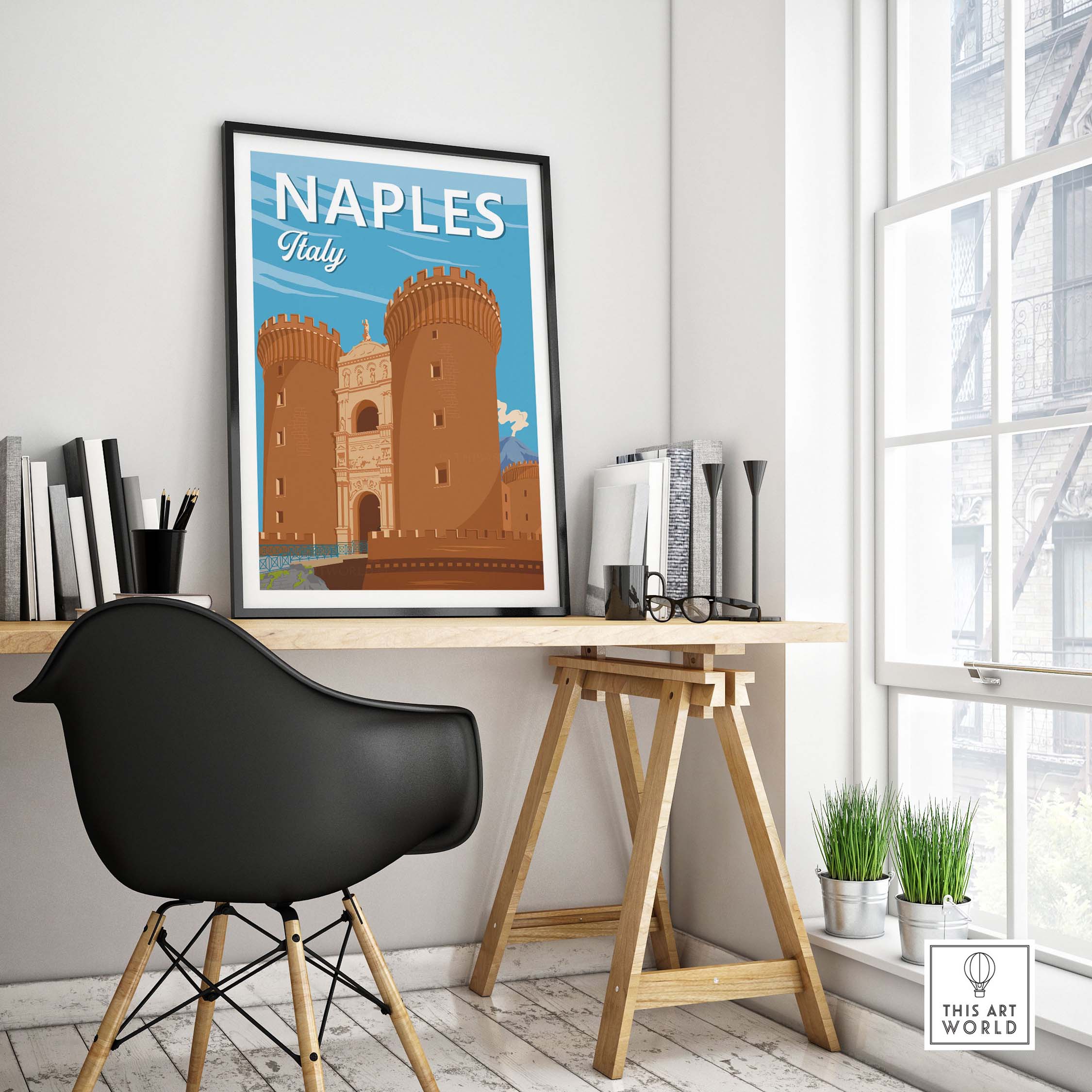 Stylish Naples Italy Print framed in a modern workspace, featuring vintage travel poster design with a castle.