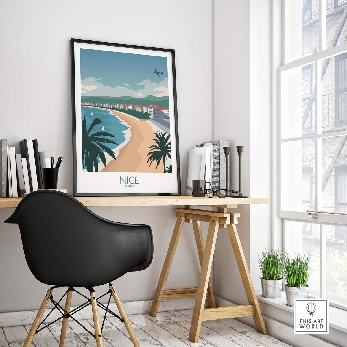 Nice France travel poster displayed in a stylish home office setting, featuring coastal scenery and vintage design.