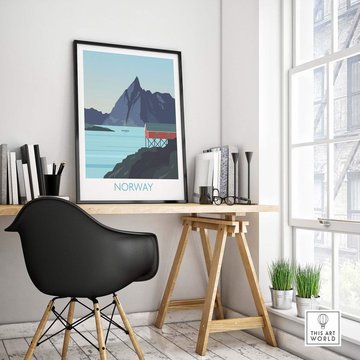 Norway print travel poster displayed in a stylish office featuring a mountain and red cabin design.