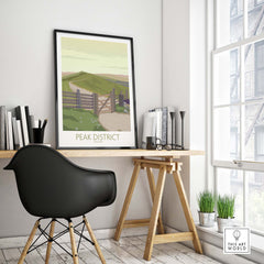 Peak District Art Print displayed in a modern workspace, showcasing a vintage-inspired travel poster.