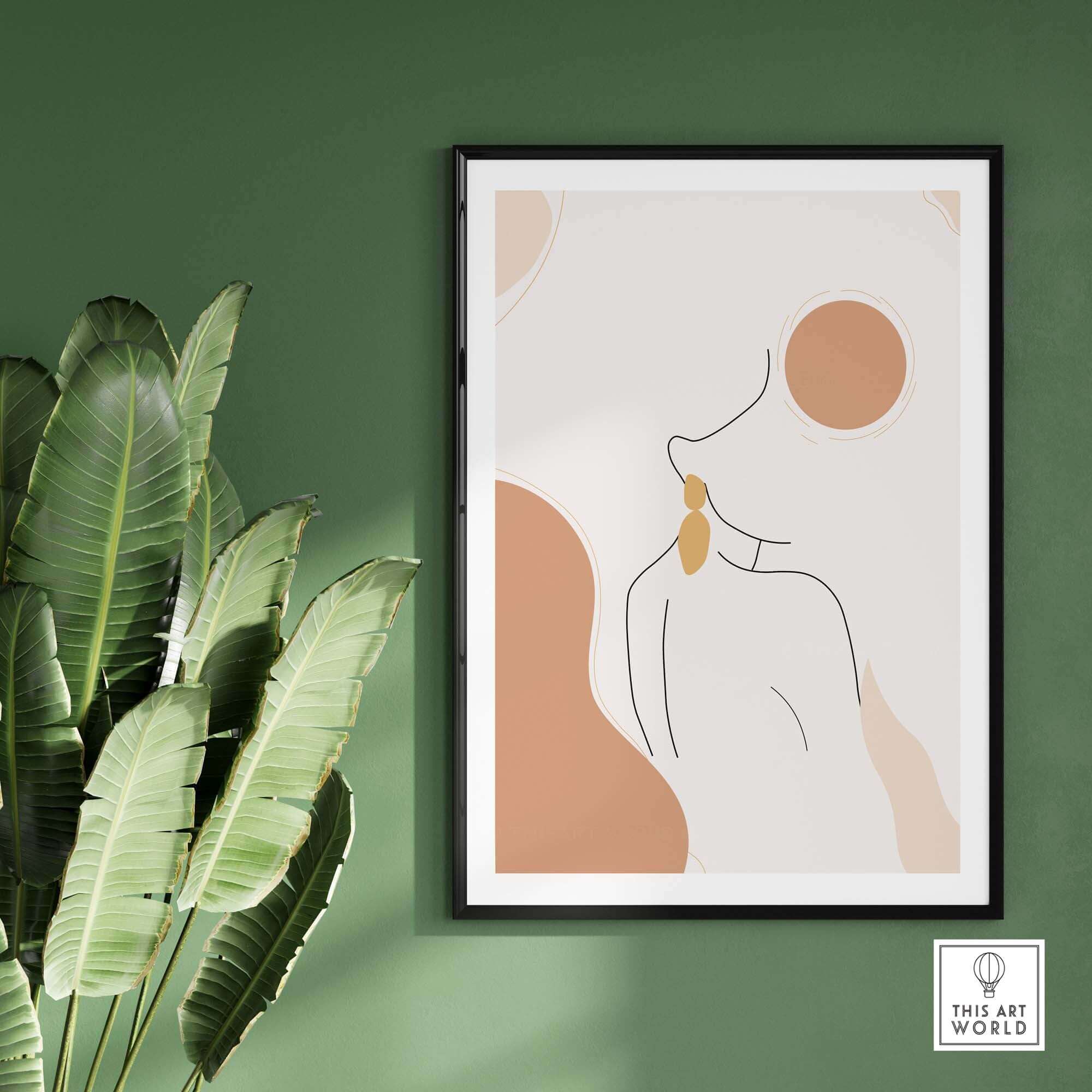 Abstract female outline print framed on a green wall, showcasing modern, conceptual art with warm tones.