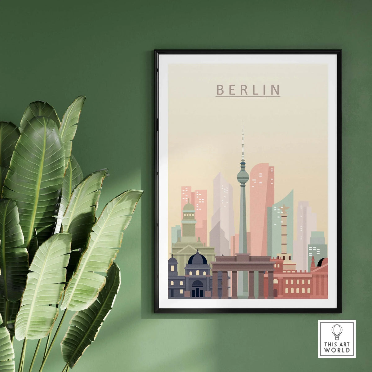 Berlin city skyline print wall art in pastel tones, framed and displayed on a green wall with plants.
