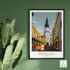 Bratislava Art Print featuring a vintage-style illustration of a city scene in Slovakia, framed and displayed on a green wall.