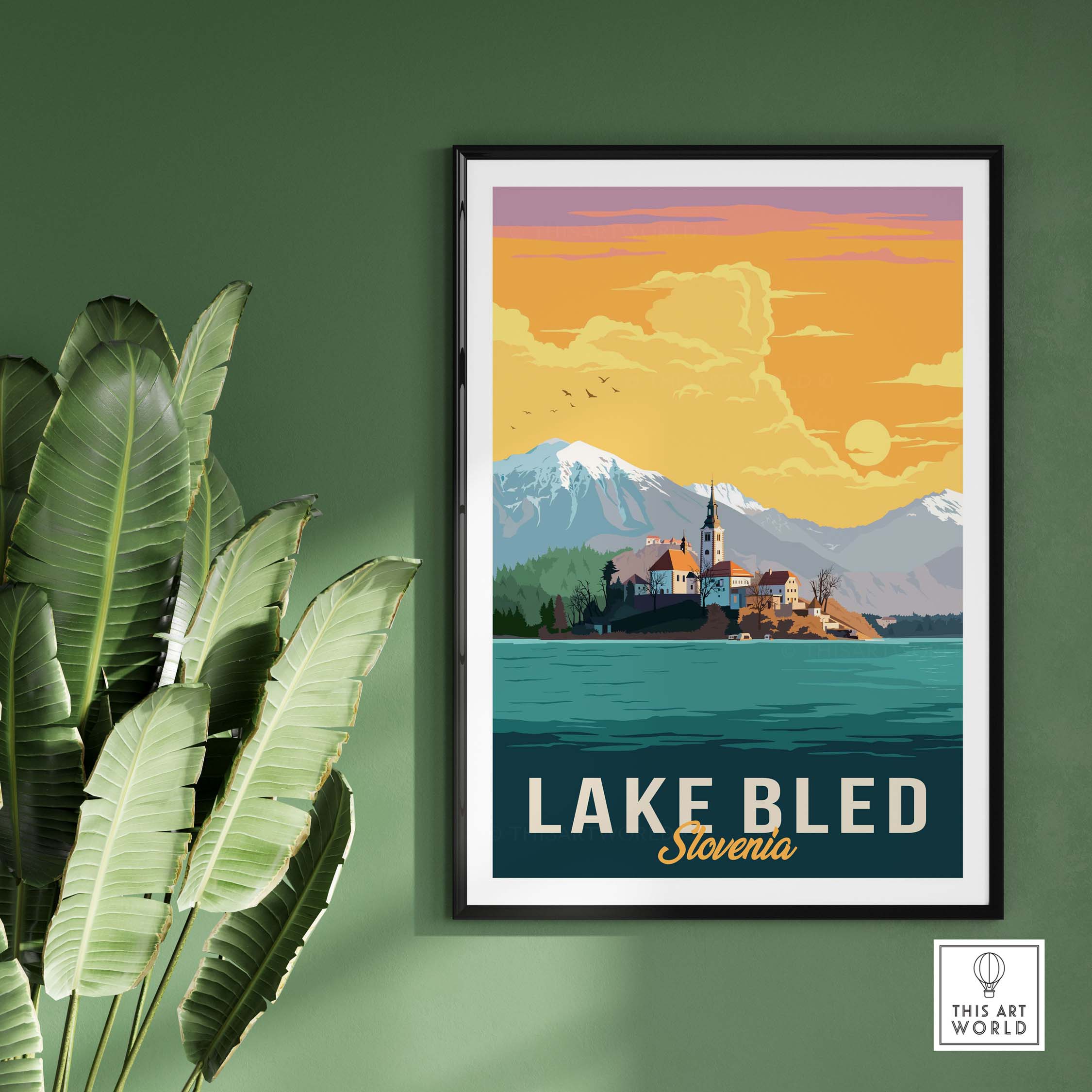 Lake Bled Print Slovenia showcasing vintage travel art, framed with green plants, perfect for home or office decor.