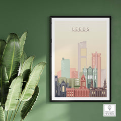 Framed Leeds Print Skyline Wall Art featuring stylish pastel cityscape on a green wall.