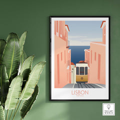 Lisbon Wall Art Poster Print featuring vintage tram, coastal view, and pastel-colored buildings on green wall.