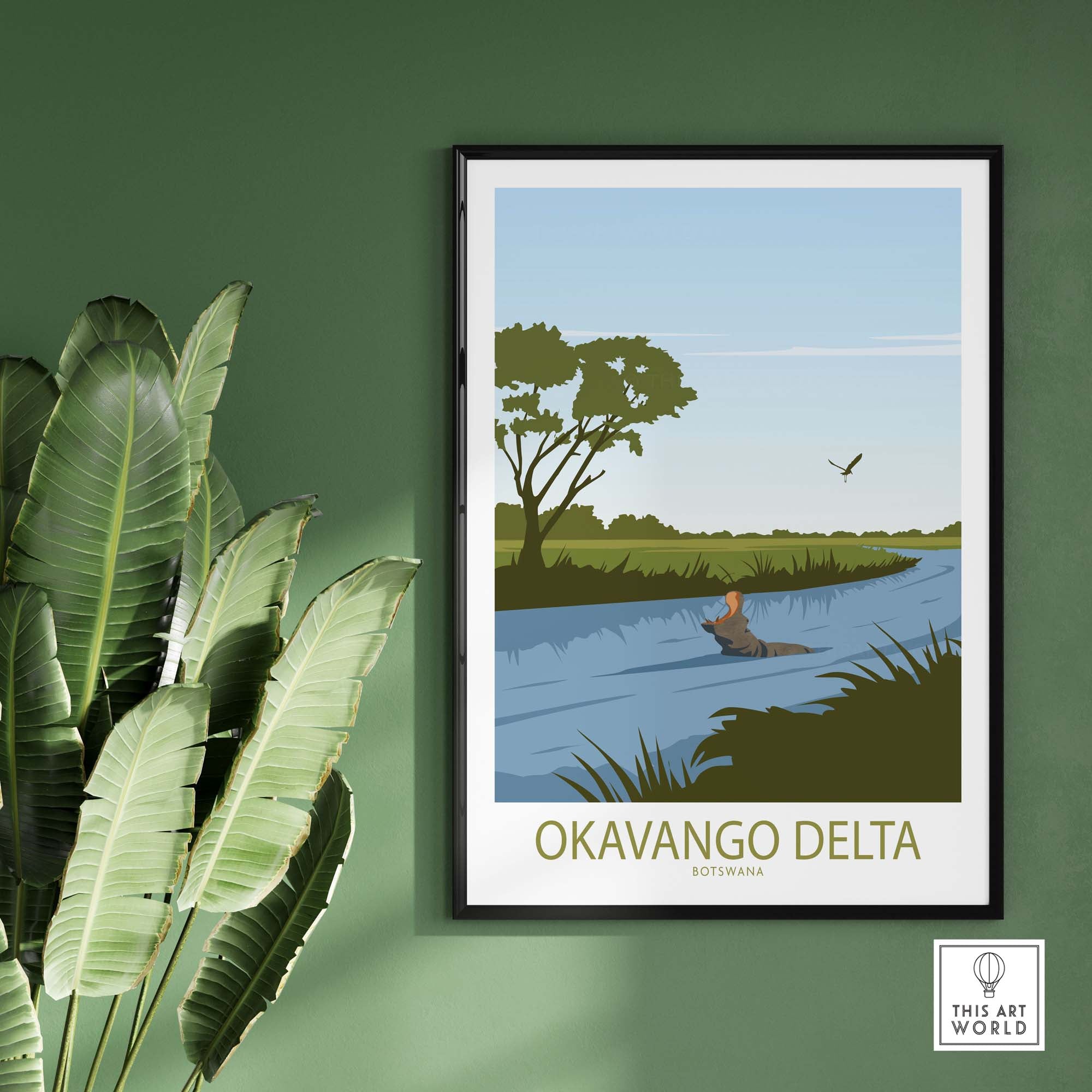 Okavango Delta Botswana vintage travel poster featuring serene river scene and wildlife, framed on a green wall.