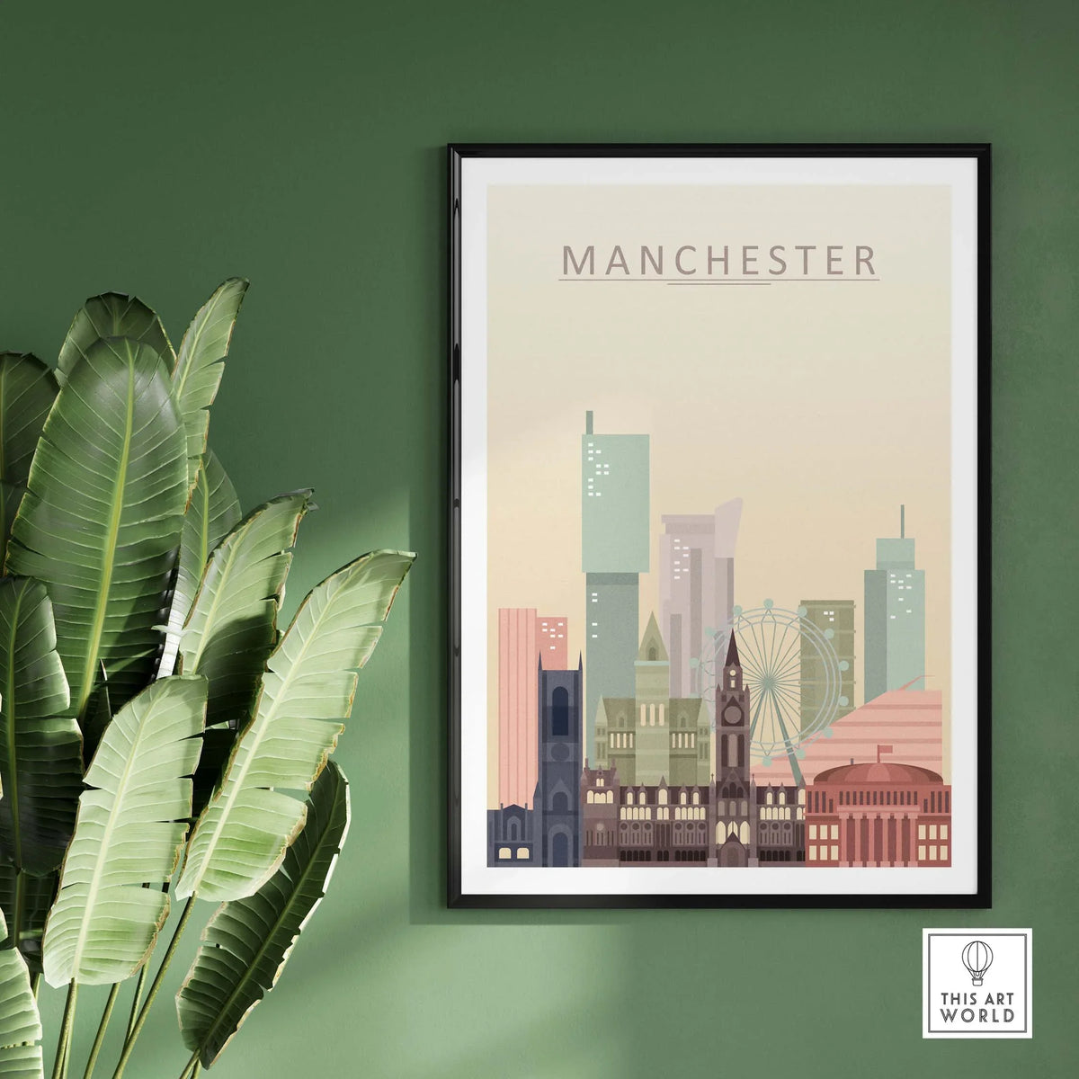 Manchester city skyline print showcasing iconic architecture in warm pastel tones, framed and displayed on a green wall.