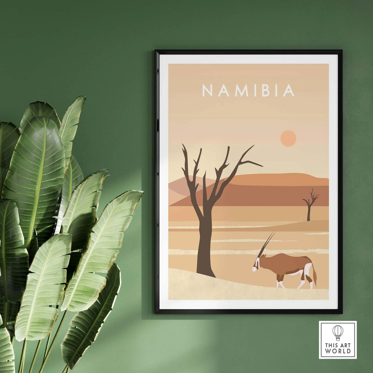 Namibia Print Dunes Poster featuring desert landscape with antelope, framed on a green wall for stylish home decor.