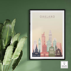 Oakland skyline wall art print featuring iconic architecture in warm pastel tones, framed on a green wall.