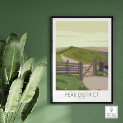 Peak District Art Print featuring a scenic landscape, framed on a green wall with lush plant decor.