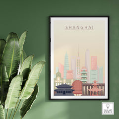 Framed Shanghai Skyline Print in pastel colors on a green wall, showcasing iconic architecture and cityscapes.