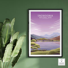 Snowdonia National Park poster featuring minimalist landscape art, framed against a green wall.