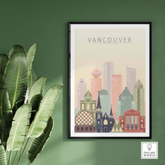 Vancouver city skyline print in pastel colors framed on green wall with plants, modern wall art decor.