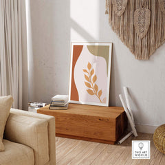 Abstract leaf wall art in a stylish modern interior, featuring warm colors and natural textures.