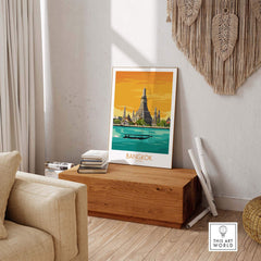 Framed Bangkok travel poster showcasing a vibrant scene of Thai architecture and nature in a stylish home setting.