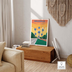 Brussels Print travel poster displayed in a stylish living room setting on a wooden table.