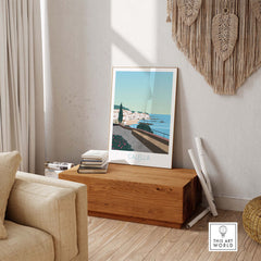 Costa Brava Calella Spain poster displayed in a living room, showcasing stylish wall art and travel inspiration.