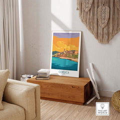 Stylish Corsica poster in a modern living room with wood accents and vibrant colors, showcasing travel nostalgia.