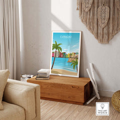 Curacao Poster Print displayed in an inviting living room setting, featuring colorful houses and a serene beach view.