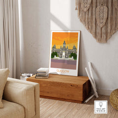 Glasgow Travel Poster Art Print displayed in a stylish living room on a wooden box.