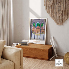 Granada Spain vintage travel poster print displayed in a stylish living room setting, framed on wooden chest.