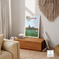 Hamburg vintage travel poster in a minimalist frame, showcasing a serene landscape with boats on water.