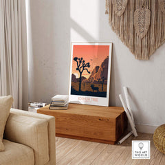 Joshua Tree wall art poster displayed in a modern living space with a wooden table and cozy decor.