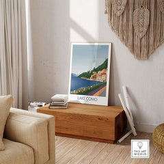 Lake Como wall art print displayed in a cozy living room setting, showcasing vintage travel poster design.