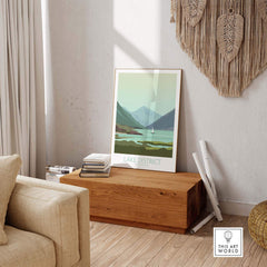 Lake District poster print displayed in a stylish living room, showcasing vintage travel art and scenic mountains.