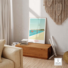 Aruba Caribbean poster featuring a tropical scene with flamingos, displayed in a stylish living room setting.