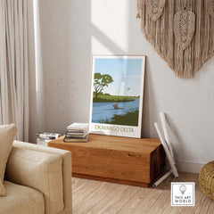 Okavango Delta travel poster displayed in a stylish living room with natural decor and warm light.