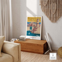 Marseille poster wall art displayed in a stylish living room on a wooden box.