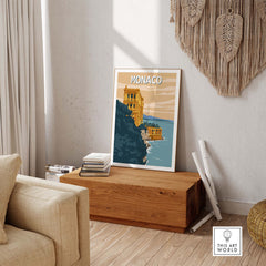 Monaco Wall Art Print displayed in a stylish living room, featuring vintage travel poster design, showcasing scenic architecture.