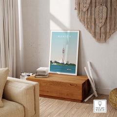 Munich Print Travel Poster displayed in a stylish living room, featuring a vintage design with the Munich skyline.