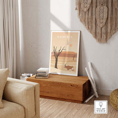 Namibia Print Dunes Poster displayed in a stylish living room, evoking wanderlust and vintage travel aesthetics.