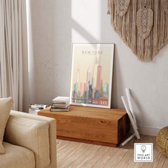 New York City skyline print wall art framed on wooden box in a cozy interior setting, featuring iconic buildings in pastel tones.